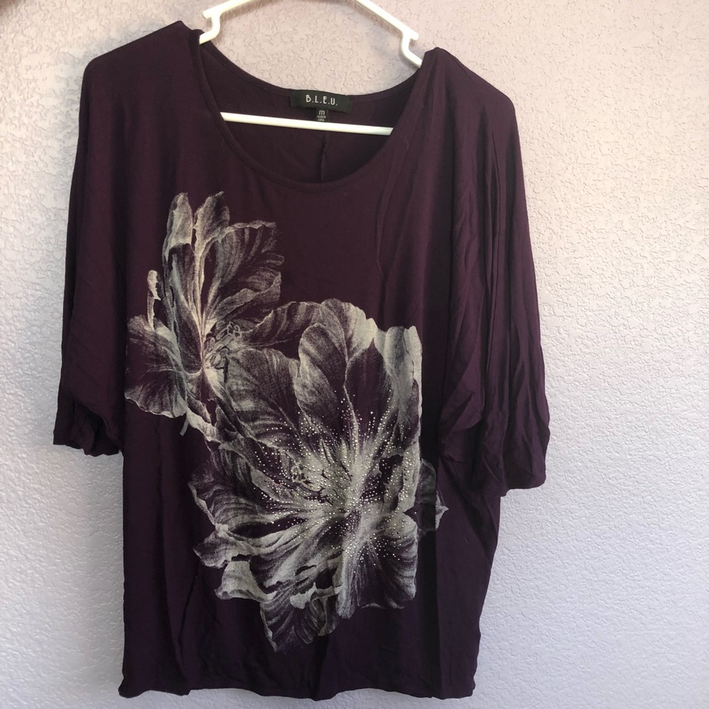 Mid sleeved, long purple women’s top